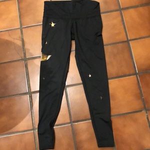 TEEKI black with gold foil moon and stars. NWOT. Size M.